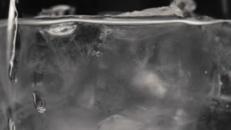 Frozen-cubes-sparkling-water-closeup-slow-motion.-Tonic-pure-cocktail-concept
