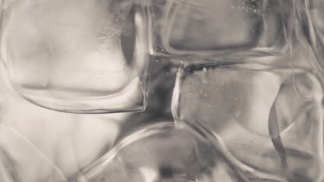 Closeup-ice-cubes-water-spinning-slow-motion.-Refreshing-cool-beverage-concept