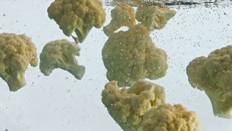 Fresh-cauliflower-floating-water-super-slow-motion-closeup.-Cabbage-underwater