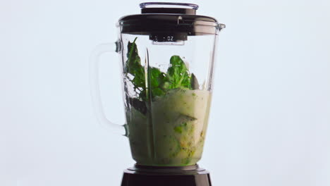 Electric-blender-mixing-vegetable-fruits-herbs-in-super-slow-motion-close-up.