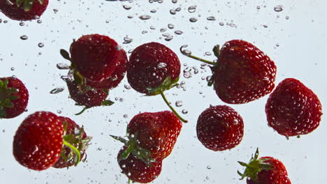 Fresh-strawberry-floating-water-in-super-slow-motion-close-up.-Berry-in-liquid.