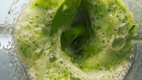 Closeup-vegetable-blend-mixing-inside-blender-in-super-slow-motion-top-view.