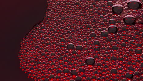 Sizzling-foam-red-liquid-surface-closeup.-Bubbled-rose-wine-texture-top-view