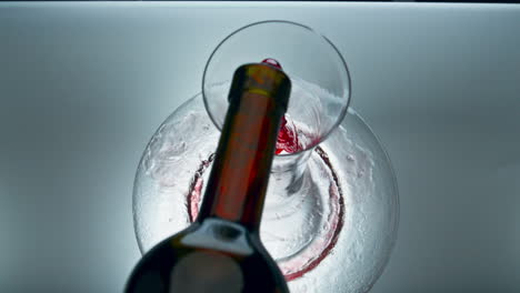 Bottled-expensive-red-wine-pouring-decanter-closeup.-Rose-beverage-filling-bowl