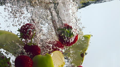 Tasty-fruits-splashing-water-in-super-slow-motion-close-up.-Vitamin-ingredients.