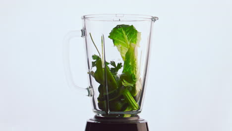 Sliced-vegetable-fall-blender-in-super-slow-motion-closeup.-Veggies-fruits-herbs