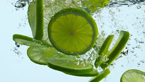 Juicy-lime-fall-water-on-white-background.-Citrus-floating-underwater-closeup.