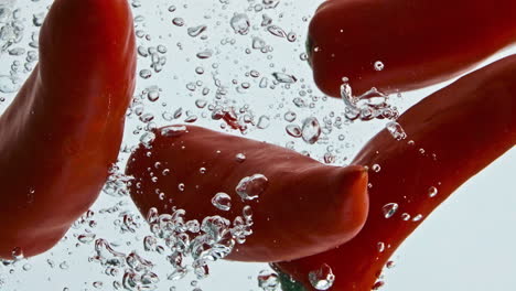 Chili-peppers-drop-water-in-light-background-closeup.-Organic-tasty-vegetable