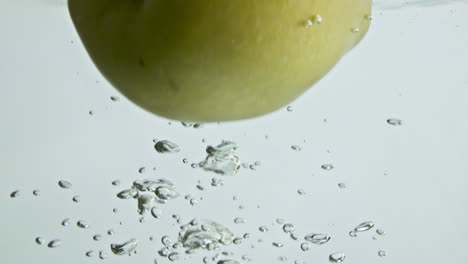 Sweet-apple-falling-water-closeup.-Delicious-garden-fruit-splashing-dropping