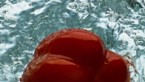 Organic-bell-pepper-splashing-water-closeup.-Red-delicious-paprika-bouncing