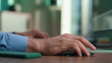 Anonymous-man-typing-text-using-computer-closeup.-Director-arms-pressing-buttons