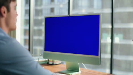 Unknown-businessman-chroma-key-virtual-call-office-closeup.-Blue-screen-device
