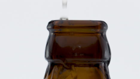Explosion-lager-beer-bottle-in-super-slow-motion-close-up.-Wheat-drink-splashing