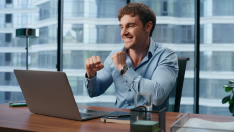 Young-businessman-rejoicing-profit-growth-closeup.-Man-gesturing-yes-alone