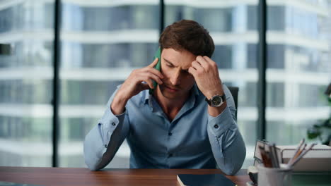 Worried-business-man-talking-phone-closeup.-Sad-entrepreneur-discussing-problems