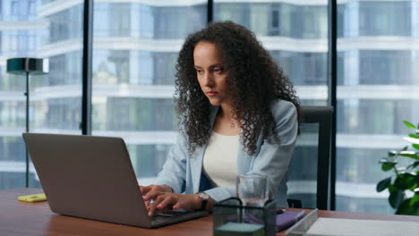 Thoughtful-business-woman-working-laptop-in-office.-Focused-ceo-making-project