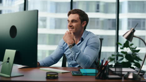 Office-manager-feeling-happy-reading-news-at-computer-closeup.-Man-rejoicing