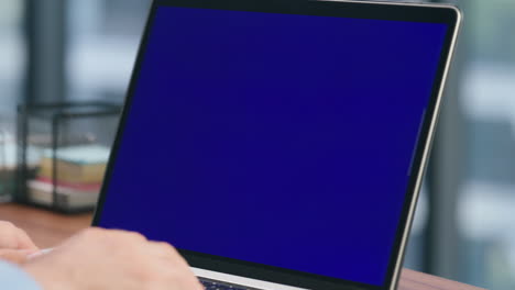 Closeup-man-arms-texting-blue-screen-laptop.-Smart-ceo-typing-pressing-buttons