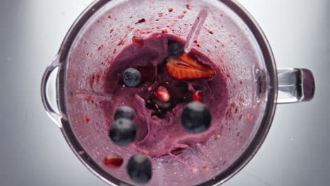 Tasty-berries-adding-smoothie-in-super-slow-motion-close-up.-Homemade-yogurt.