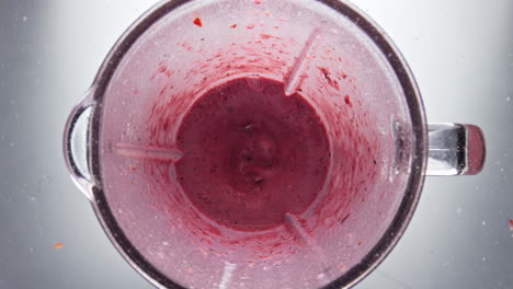 Fresh-berry-blend-mixing-in-blender-close-up.-Cooking-dairy-homemade-yogurt.