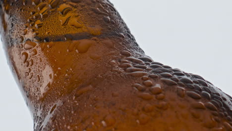 Water-drops-beer-bottle-flowing-in-super-slow-motion-closeup.-Cold-alcohol-drink