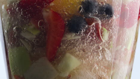 Rotating-fruits-berries-blender-in-super-slow-motion-close-up.-Cook-smoothie.