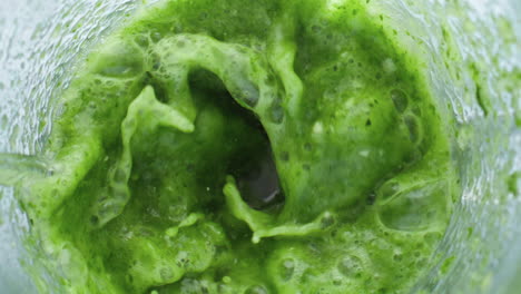 Electric-mixer-blending-vegetables-fruits-herbs-in-super-slow-motion-close-up.