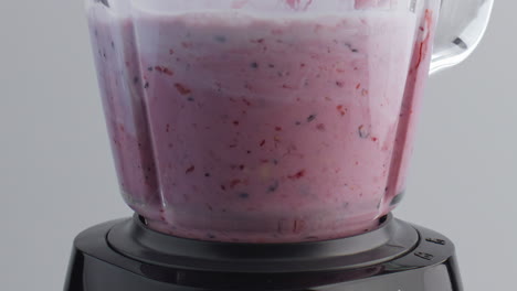 Preparing-fruit-yogurt-blender-close-up.-Blending-natural-organic-food-in-mixer.