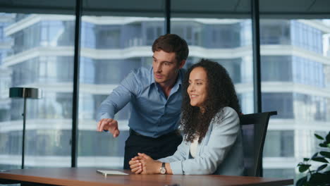Two-professionals-invisible-screen-at-office-closeup.-Man-woman-swiping-hands
