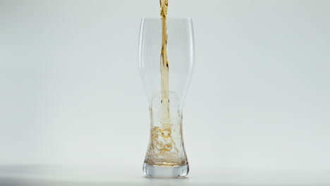 Light-beer-splashing-glass-in-super-slow-motion-close-up.-Lager-drink-pouring.