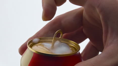 Man-opening-beer-can-in-super-slow-motion-closeup.-Foam-pouring-out-from-canakin