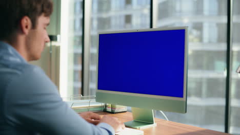 Zoom-on-ceo-looking-mockup-computer-office.-Executive-typing-blue-screen-device
