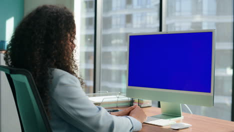 Anonymous-manager-talking-blue-screen-monitor.-Ceo-having-mockup-videocall