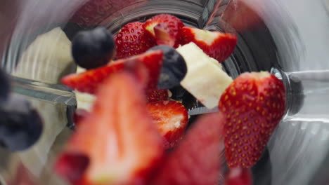 Closeup-berries-dropped-blender-in-super-slow-motion.-Healthy-nutrition-concept.