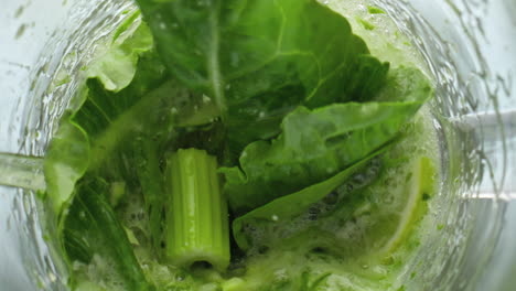 Closeup-greens-blending-mixer-in-super-slow-motion.-Preparing-vegetarian-food.