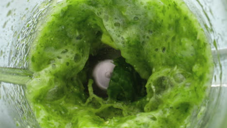 Preparing-vegetable-green-juice-in-super-slow-motion-close-up.-Detox-smoothie.