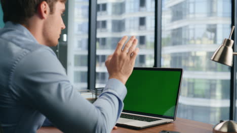 Confident-entrepreneur-mockup-laptop-video-call-in-office.-Job-interview-concept