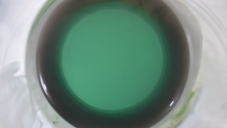 Unfiltered-ale-glass-flask-closeup.-Hoppy-fresh-beer-in-opened-green-vessel