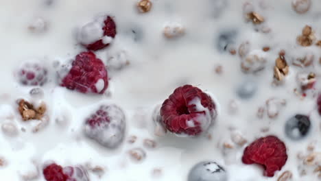 Berries-muesli-floating-milk-closeup.-Delicious-cereal-granola-yoghurt-spinning