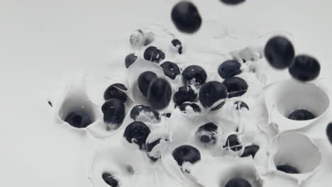 Closeup-blueberry-falling-yogurt-in-super-slow-motion.-Delicious-milky-cocktail.