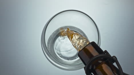 Craft-beer-filling-glass-closeup.-Refreshing-ale-jet-bubbling-pouring-vessel