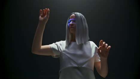 Futuristic-girl-swiping-virtual-reality-panel-closeup.-Beautiful-gamer-gesturing