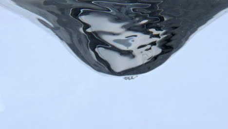 Beverage-whirlpool-rotating-inside-vessel-closeup.-Clean-liquid-swirling-moving