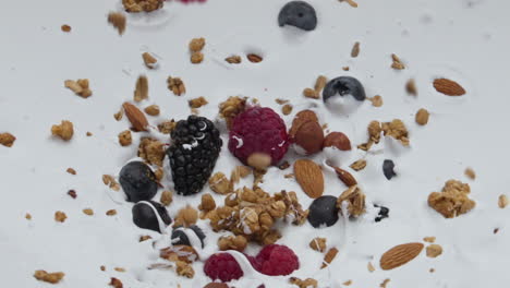 Berries-muesli-falling-yogurt-in-super-slow-motion-close-up.-Healthy-breakfast.