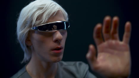 Addicted-gamer-examining-virtual-reality-world.-Metaverse-technology-concept
