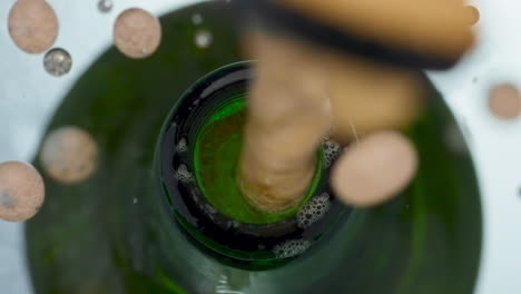 Lager-bottle-cap-popping-closeup.-Golden-carbonated-beer-splashing-slow-motion