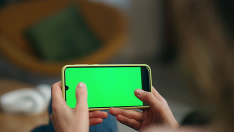 Player-fingers-gaming-chromakey-cellphone-home.-Girl-hands-tapping-mockup-phone