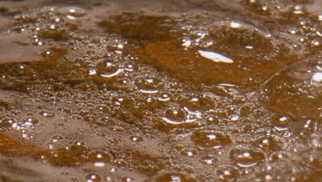 Cold-ipa-pouring-glass-closeup.-Craft-brewery-beer-filling-glassware-slow-motion
