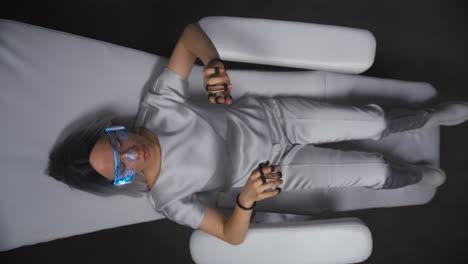 Nano-technologies-woman-immersed-VR-top-view.-Gamer-enjoying-haptic-gloves