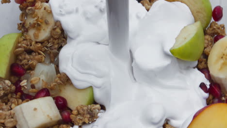 Cream-pouring-fruit-muesli-in-super-slow-motion-close-up.-Healthy-lifestyle.